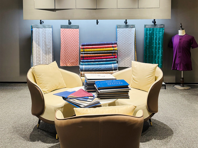 Kingsen International fabric showroom displaying Bazin, TR fabric, Swiss voile and uniform materials