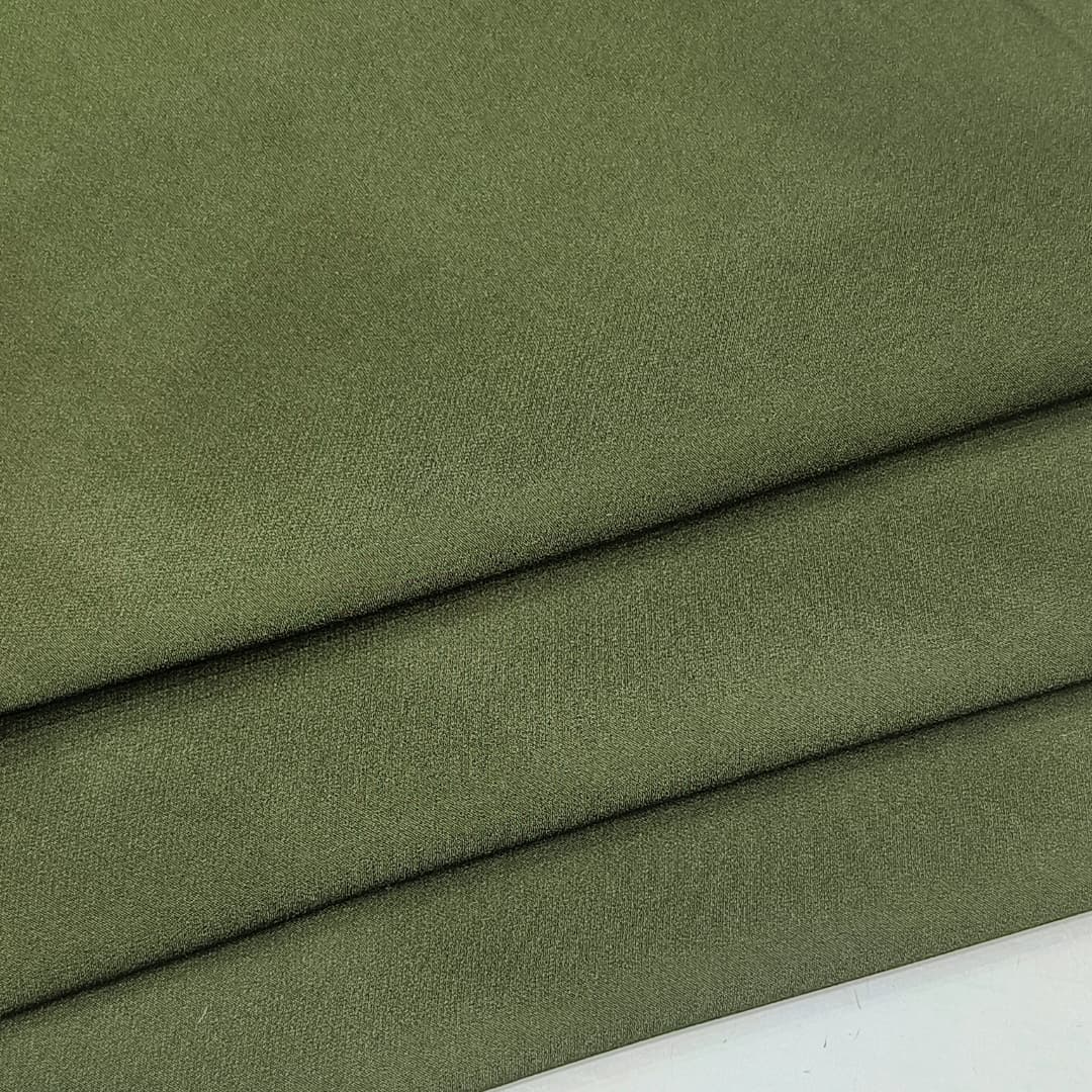 Manufacturing process of double-layer four-way stretch fabric